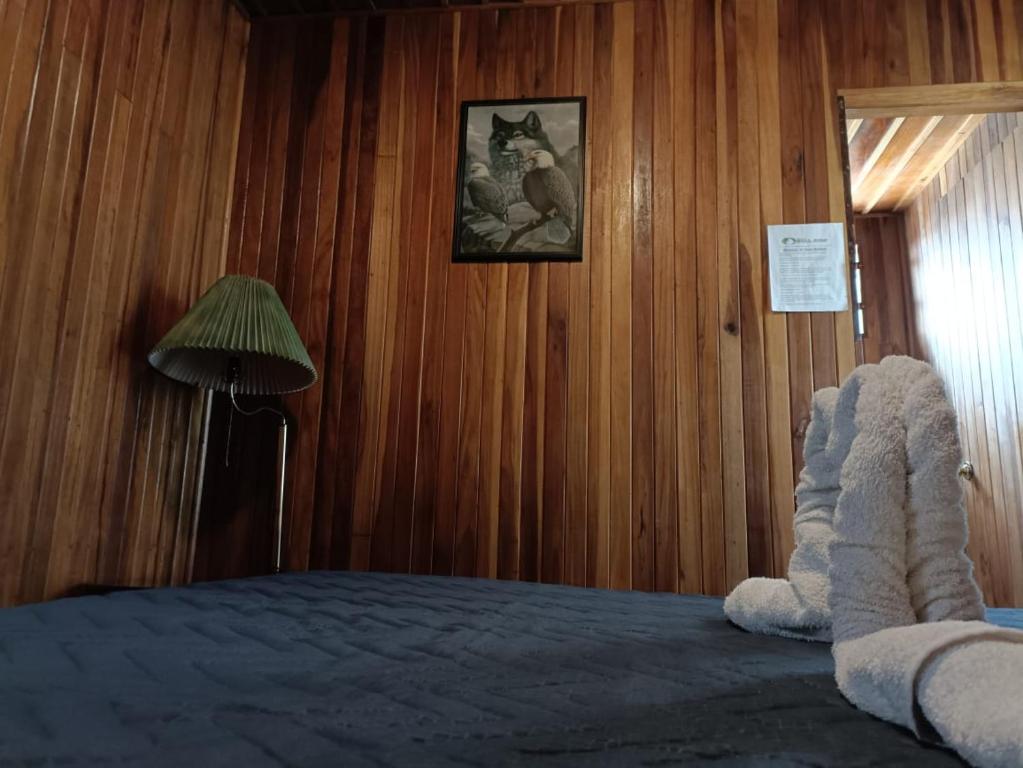 Habitacion Doble — cama matrimonial y area de estar